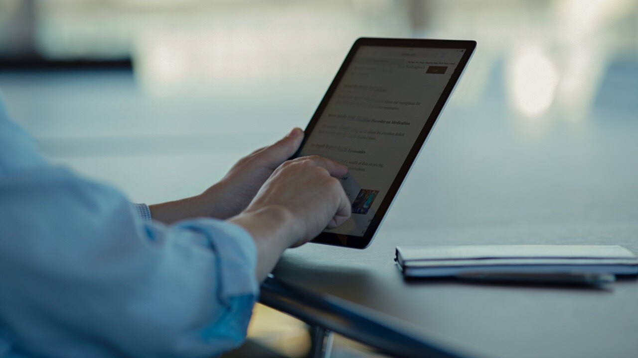 Person scrolling on tab