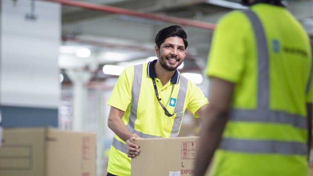 Warehouse employees working together