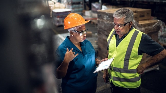 Coworkers on a meeting at warehouse