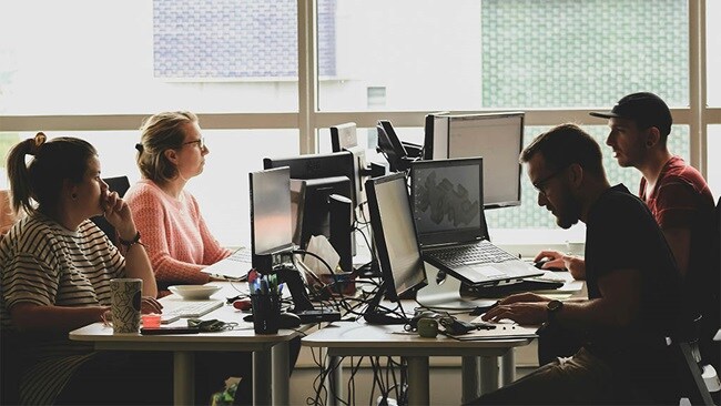 A group of people working in logistics tech startups.