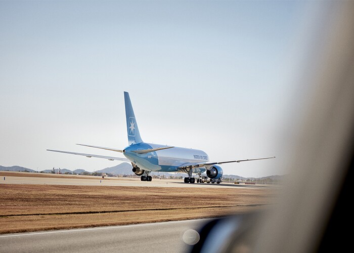 Maersk plane parked on an airstrip