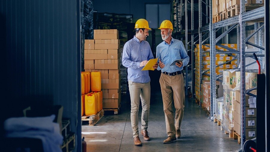 Two men in a warehouse