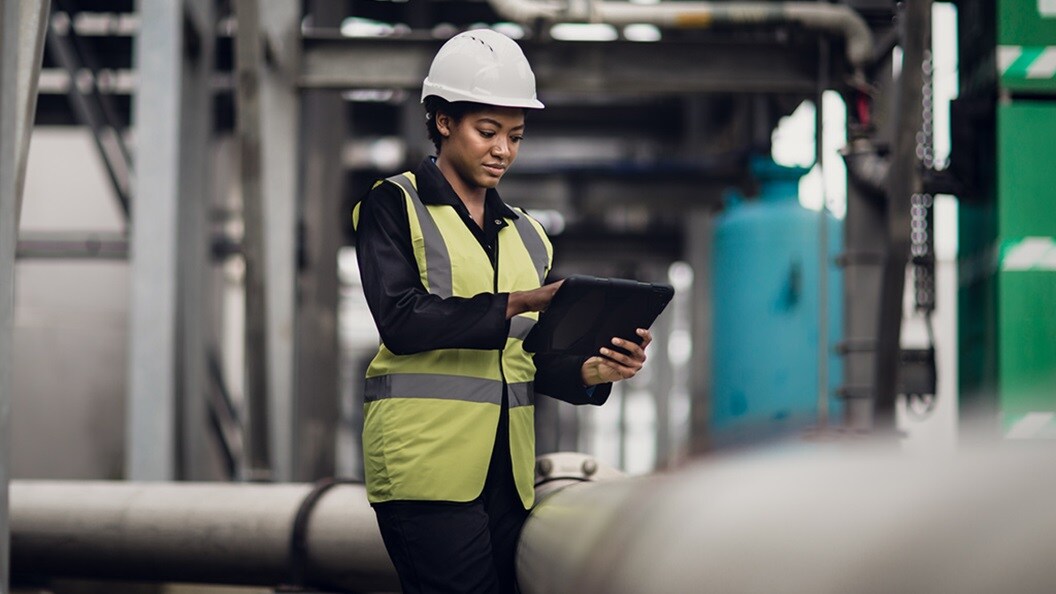 A woman works on her laptop symbolising the growing interest in green fuels. 