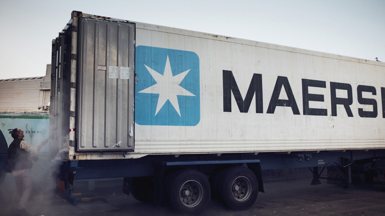 Maersk shipping container at a loading facility.