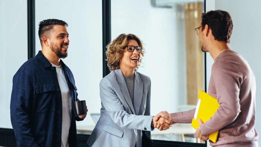 Two men and a woman meeting