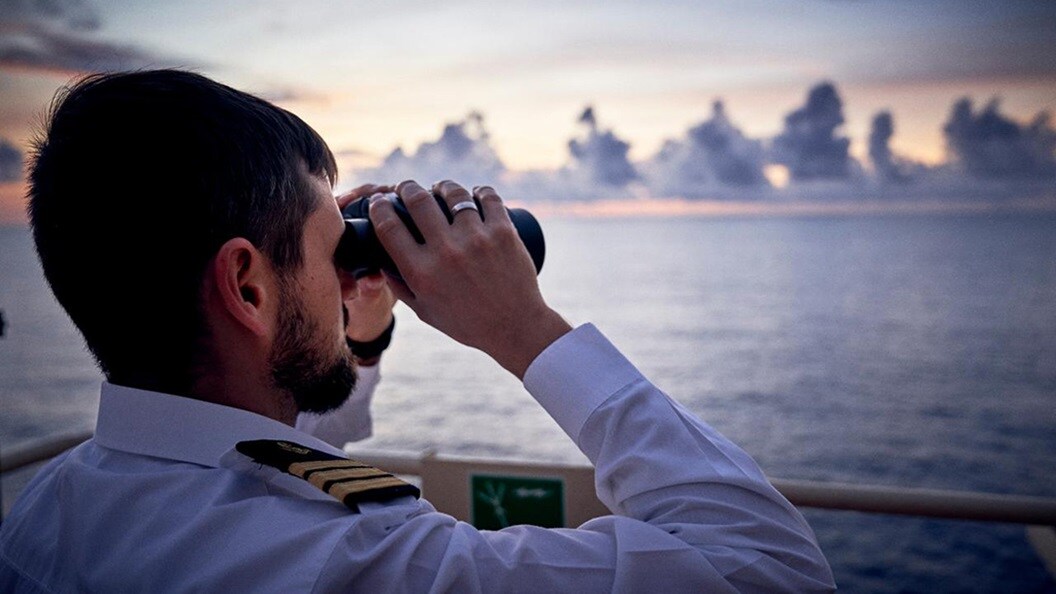 Person in a white uniform with epaulettes