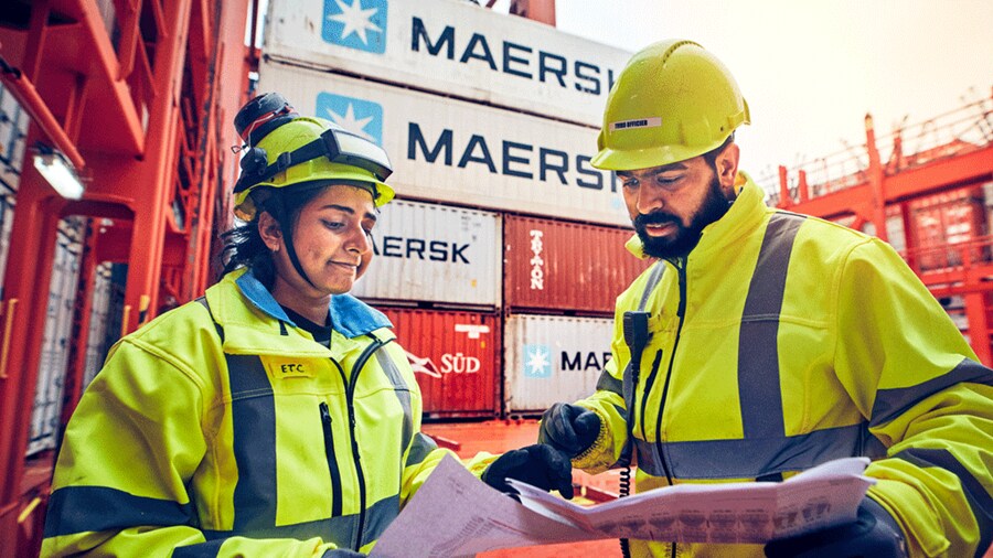 Woman man employee at port area with documents