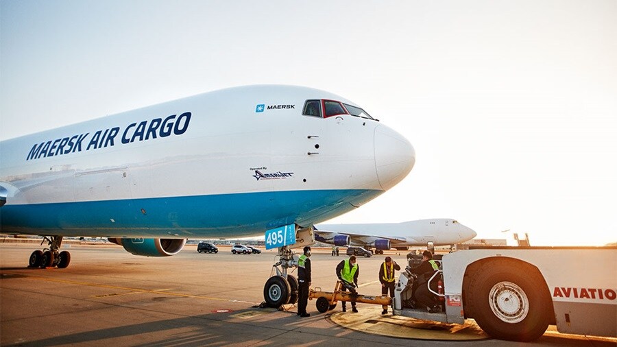 Maersk Air Cargo airplane loading cargo at the airport.