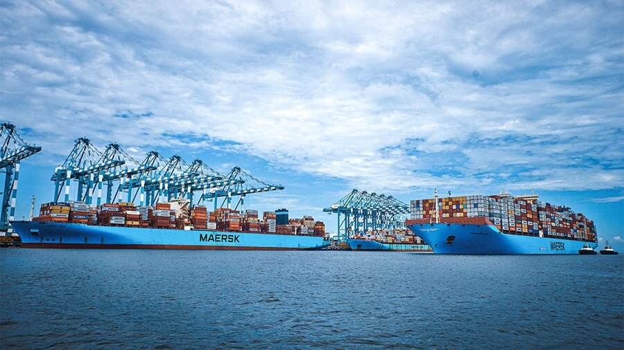 Maersk vessels carrying containers at the port.
