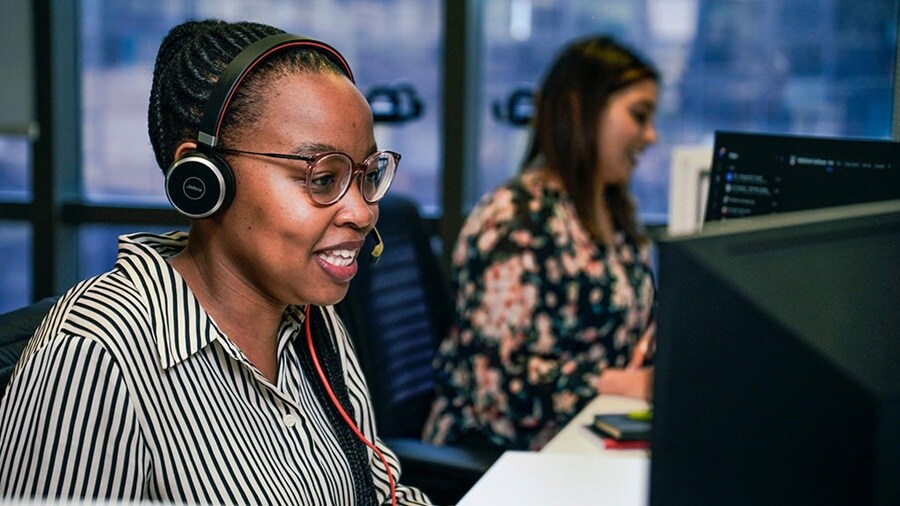 Woman working at computer in office setting