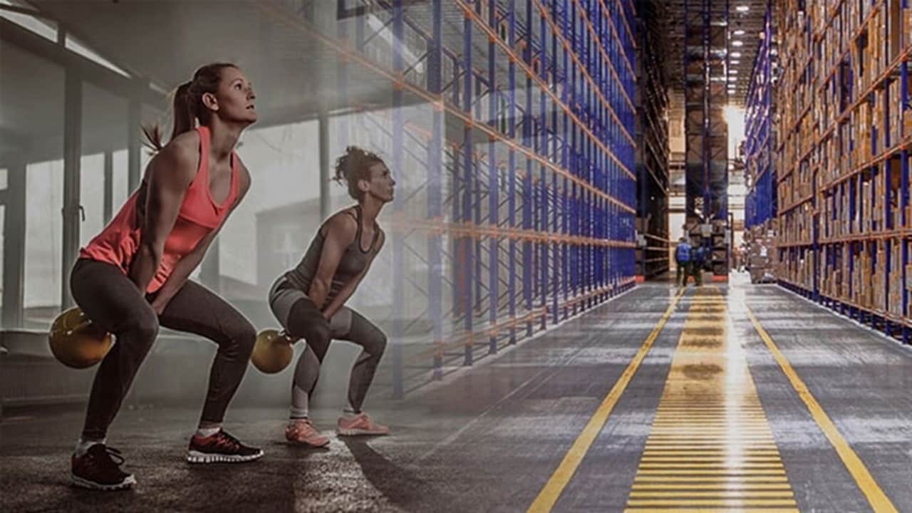 Impact of sports industry trends on supply chains – A woman working out with training equipment.