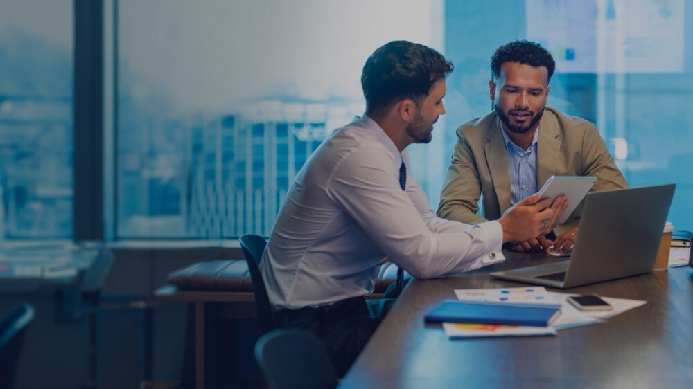 Two business professionals discussing ocean contract 