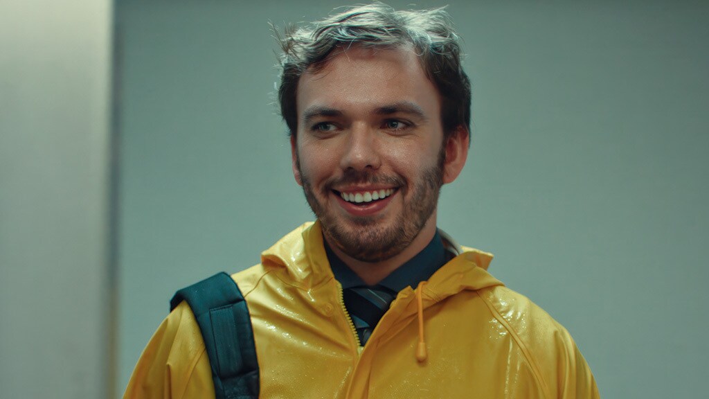 A cheerful man in a yellow raincoat symbolizes readiness and resilience in the face of logistics challenges.
